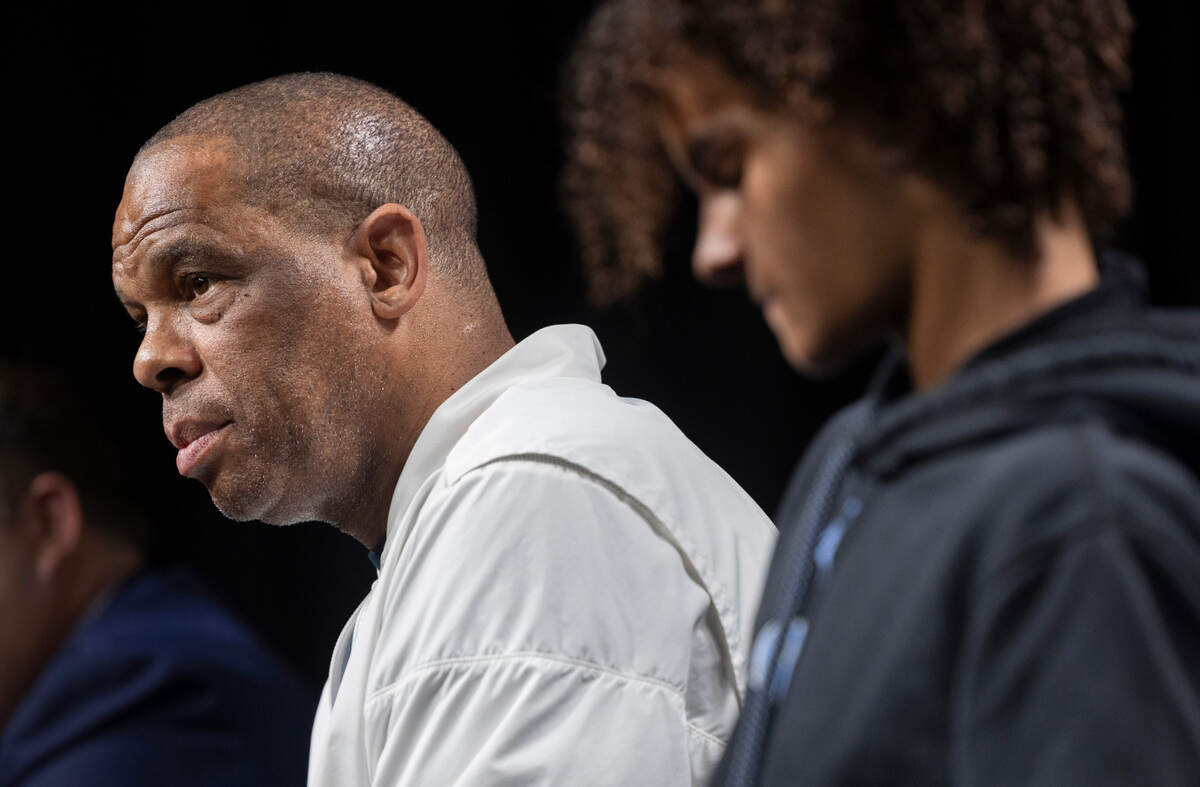 North Carolina coach Hubert Davis with his son Micah by his side, fields questions during a media availability on Wednesday, March 27, 2024 at Crypto.com Arena in Los Angeles, CA.