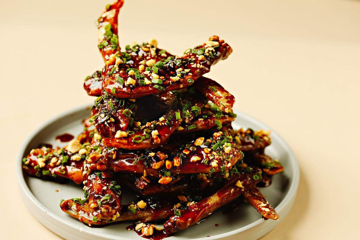 The new Crawford Cookshop, from Raleigh chef Scott Crawford, opens this week in Clayton. The menu is made of American classics with upscale touches, like these grilled duck wings with hot honey and peanuts.