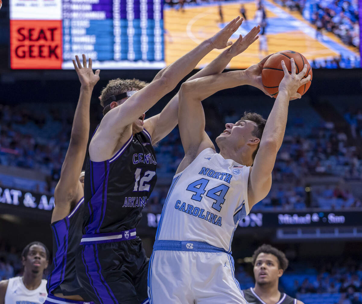Central Arkansas guard Ty Robinson (12) defends North Carolina guard Luka Bogavac (44) in the first half on November 3, 2025 at the Smith Center in Chapel Hill, N.C.