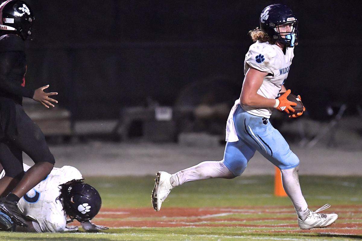 Millbrook linebacker Quinton Cypher (2) runs the ball for the touchdown off a fumble recovery against Rolesville during the first half. The Millbrook Wildcats and the Rolesville Rams met in a conference football game in Rolesville, N.C. September 26, 2025