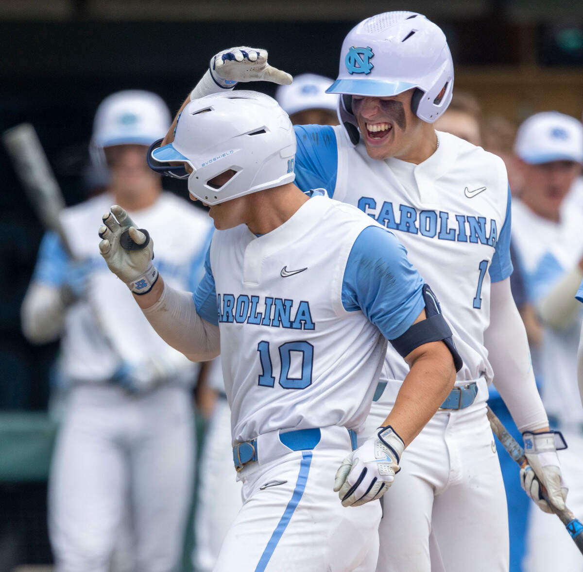 North Carolina’s Mac Horvath (10) is greeted at home plate by teammate Danny Serretti (1) after a solo home run in the third inning against Hofstra on Friday, June 3, 2022 during the NCAA Regional at Boshamer Stadium in Chapel Hill, N.C.