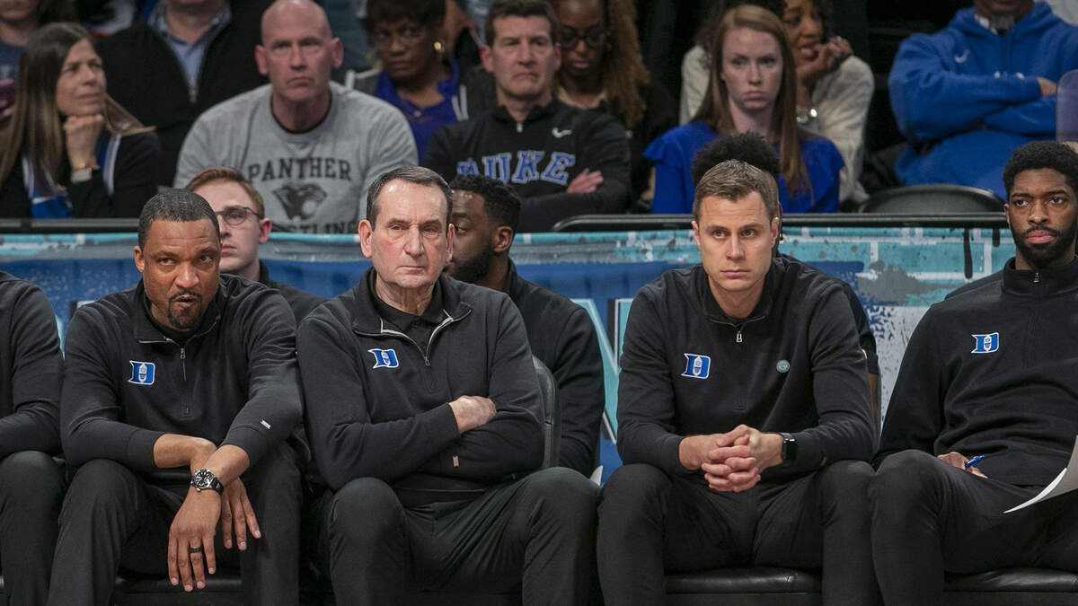 Duke assistant coach Chris Carrawell, head coach Mike Krzyzewski and assistant coach Jon Scheyer watch the closing minutes of play as Virginia Tech clinches the ACC Tournament Championship on Saturday, March 12, 2022 at Barclays Center in Brooklyn, N.Y.