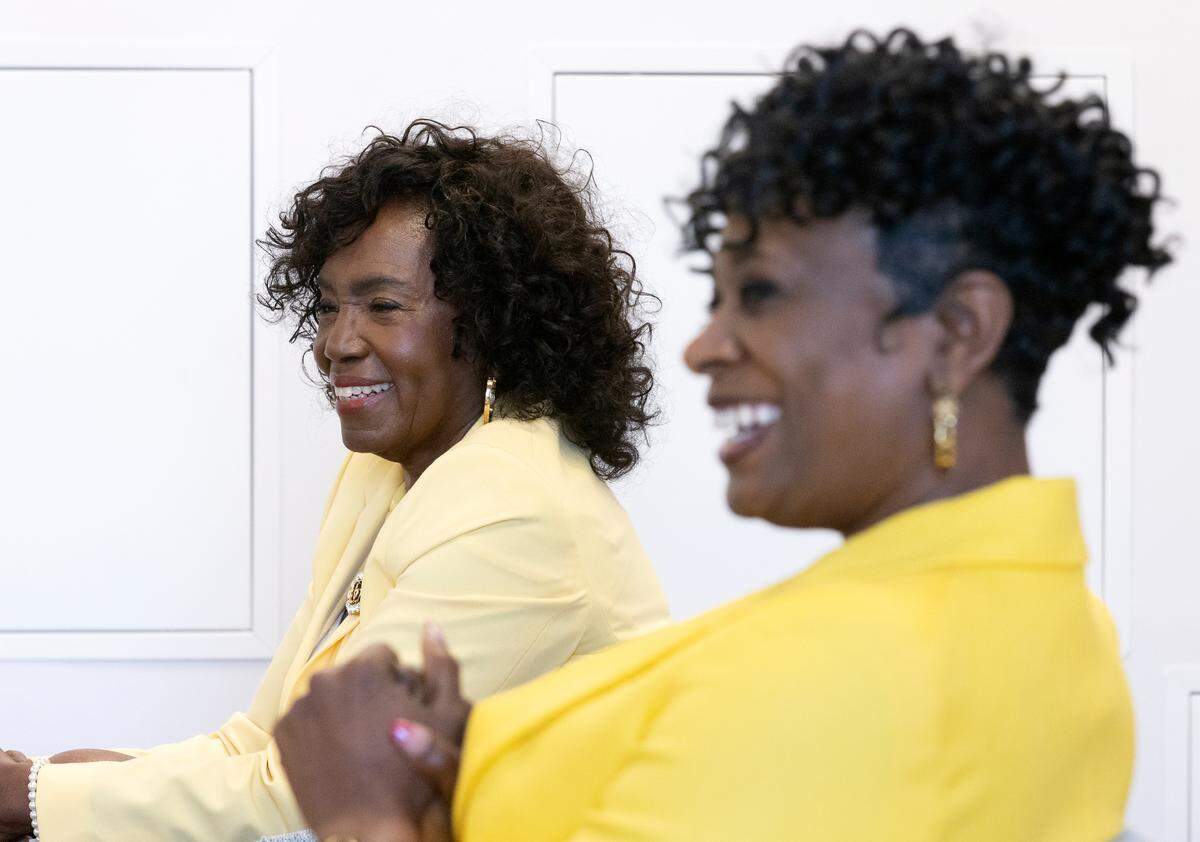 Brenda Howerton, chair of the Durham Board of County Commissioners, and Kimberly Sowell, Durham County Manager, smile during an interview in Durham, N.C. on Wednesday, Feb. 22, 2023.