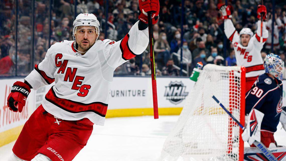 Carolina Hurricanes’ Nino Niederreiter, left, celebrates his goal against Columbus Blue Jackets’ Elvis Merzlikins during the third period of an NHL hockey game Saturday, Jan. 1, 2022, in Columbus, Ohio. (AP Photo/Jay LaPrete)