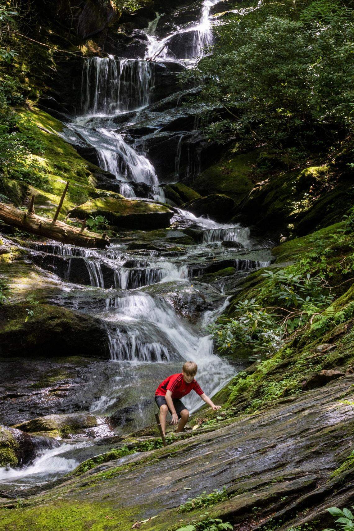 Max Moore, 11, of Charleston, S.C., explores Roaring Fork Falls, in the Pisgah National Forest. The 50-foot-high waterfall is an easy three-quarter-mile hike from a small parking area off N.C. 80.