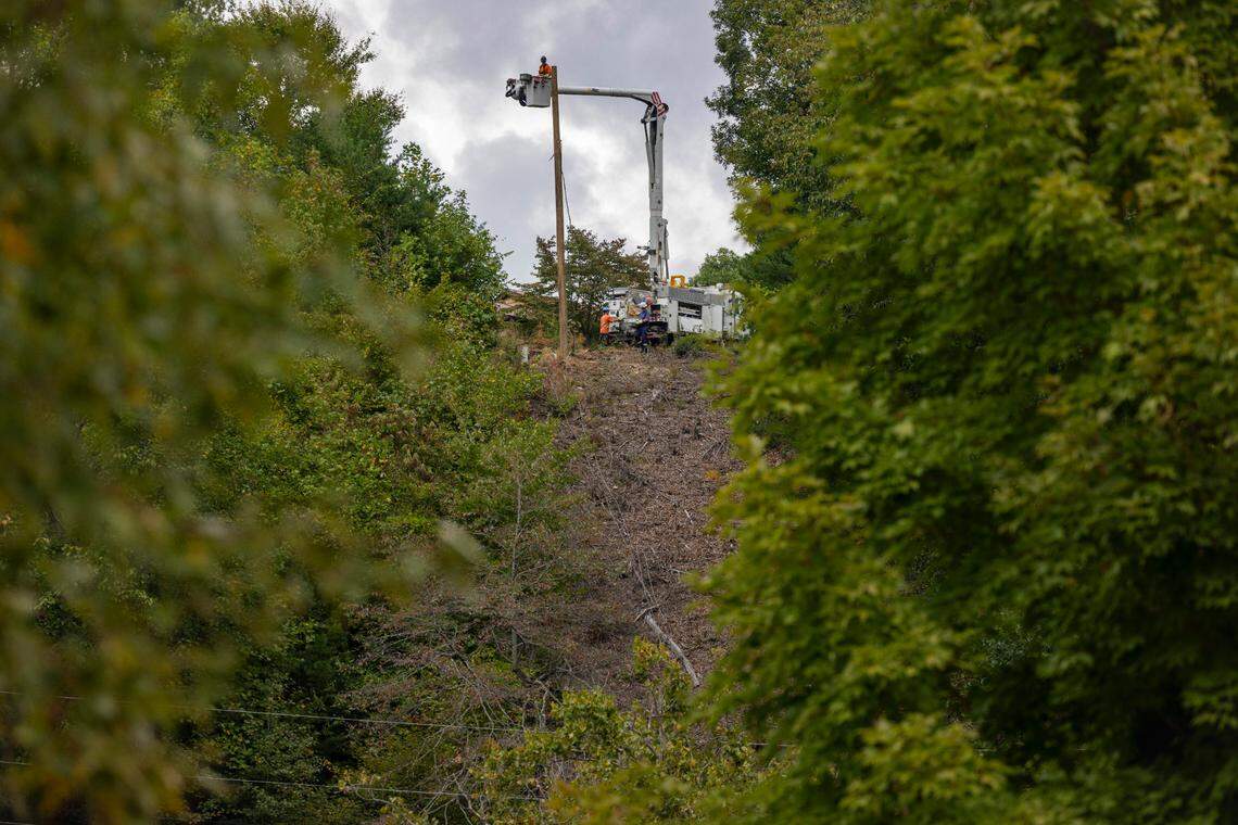 Utility contractors works to restore power to the town of Hot Springs, N.C. on Friday, October 4, 2024, one week after Hurricane Helene moved through western North Carolina.