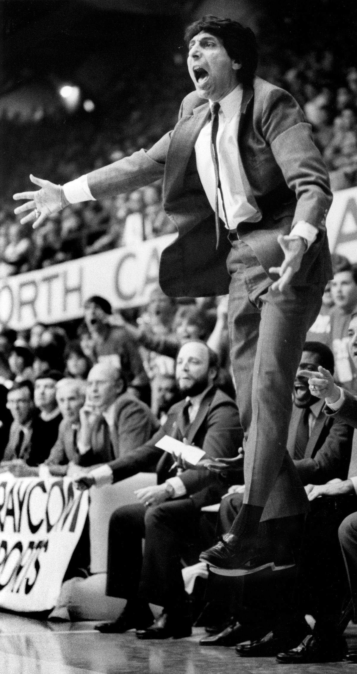 NC State coach Jim Valvano leaps from off the floor during the Wolfpack’s 85-76 victor over the rival Tar Heels of the University of North Carolina, Feb. 17, 1985.