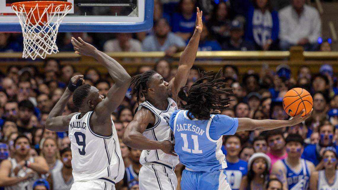 Duke center Khaman Maluach (9) and Sion James (14) defend North Carolina’s Ian Jackson (11) in the first half on Saturday, February 1, 2025 at Cameron Indoor Stadium in Durham, N.C.