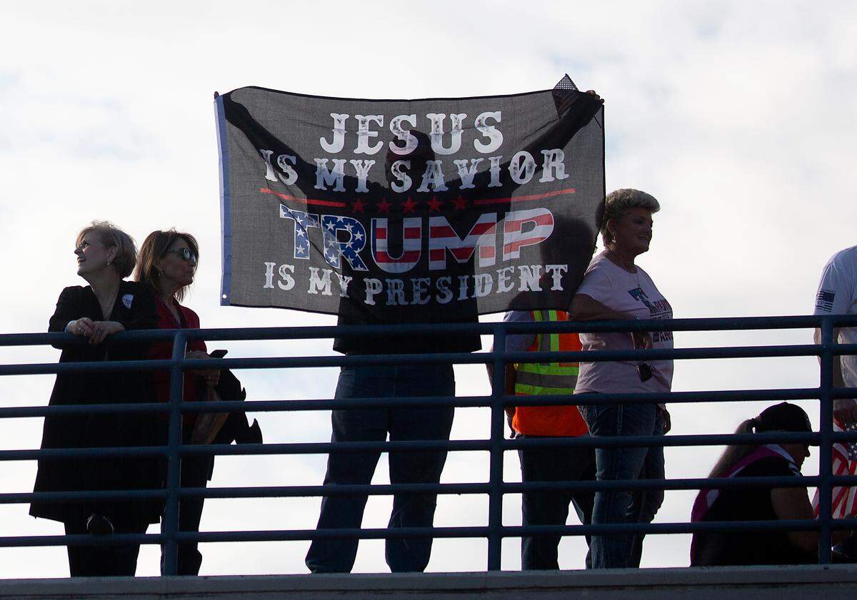 Supporters of former President and Republican presidential candidate Donald Trump gather outside First Horizon Coliseum prior to a campaign rally in Greensboro, N.C. on Saturday, Nov. 2, 2024.