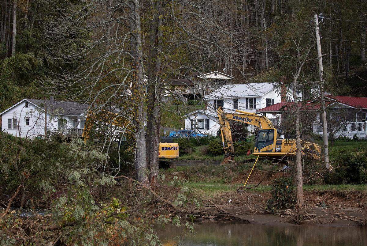 Construction equipment works along a roadside in Minneapolis, N.C. on Wednesday, Oct. 2, 2024, days after Hurricane Helene brought heavy flooding to the area.