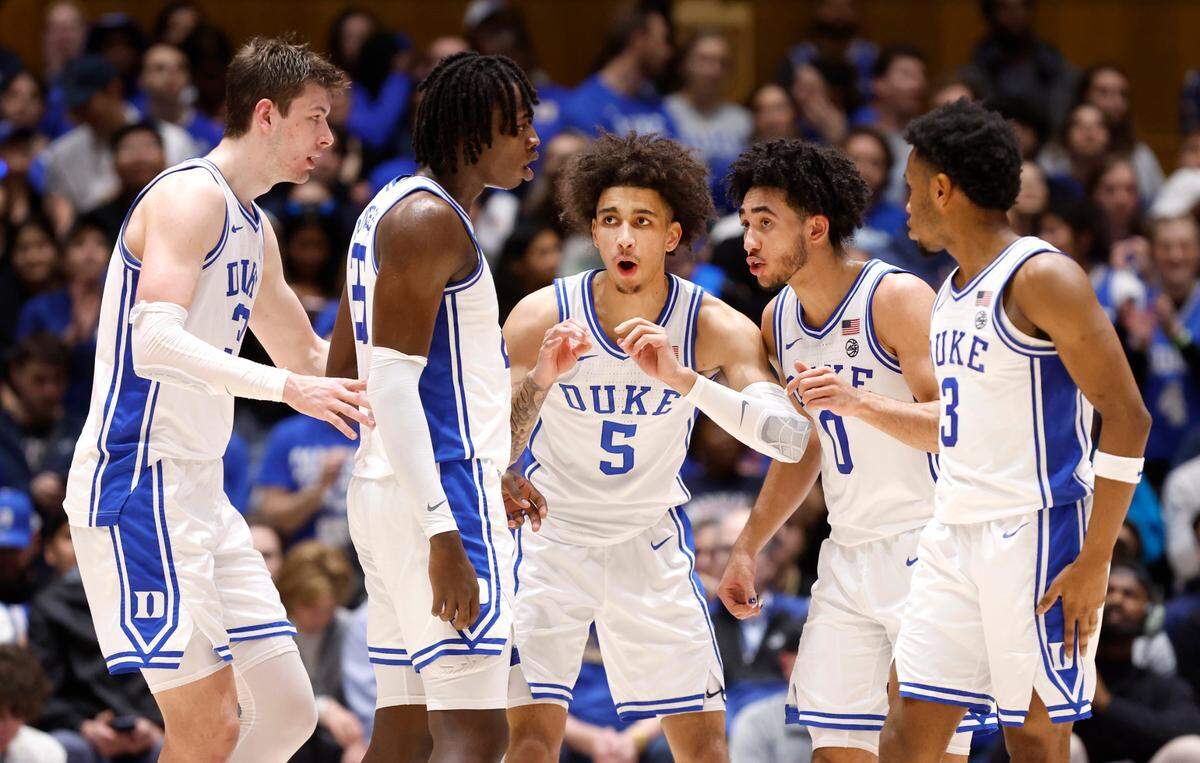 Duke’s Tyrese Proctor (5), center, huddles with, from left, Kyle Filipowski (30), Mark Mitchell (25), Jared McCain (0) and Jeremy Roach (3) during the first half of Duke’s game against Wake Forest at Cameron Indoor Stadium in Durham, N.C., Monday, Feb. 12, 2024.