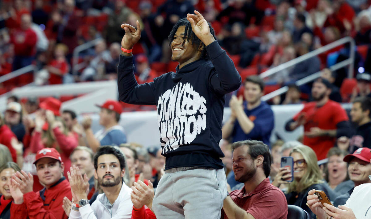 N.C. State wide receiver KC Concepcion acknowledges the crowd after being introduced during the first half of N.C. State’s basketball game against UT Martin at PNC Arena in Raleigh, N.C., Tuesday, Dec. 12, 2023.