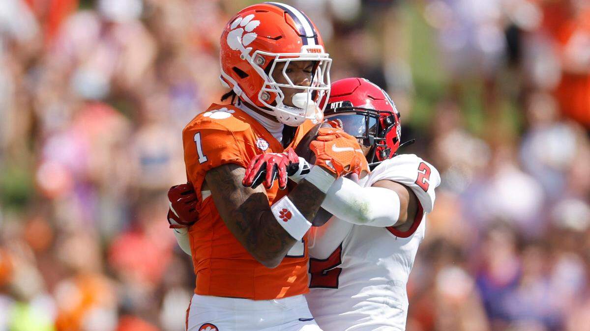 Clemson wide receiver T.J. Moore (1) pulls in a reception while defended by N.C. State cornerback Brandon Cisse (2) during the first half of N.C. State’s game against Clemson at Memorial Stadium in Clemson, S.C., Saturday, Sept. 21, 2024.