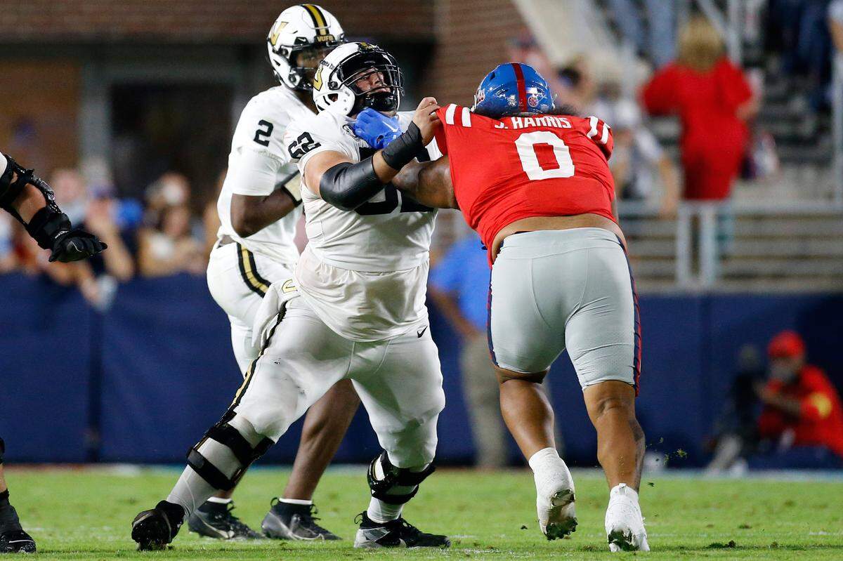 Oct 28, 2023; Oxford, Mississippi, USA; Vanderbilt Commodores offensive linemen Julian Hernandez (62) blocks Mississippi Rebels defensive linemen Joshua Harris (0) during the first half at Vaught-Hemingway Stadium.