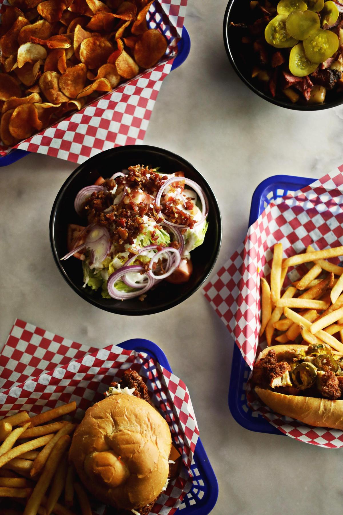 An exceptionally broad menu at Bottle Dog in Cary is divided into nine sections, including flatbreads, wings, hot dogs, and poutine.