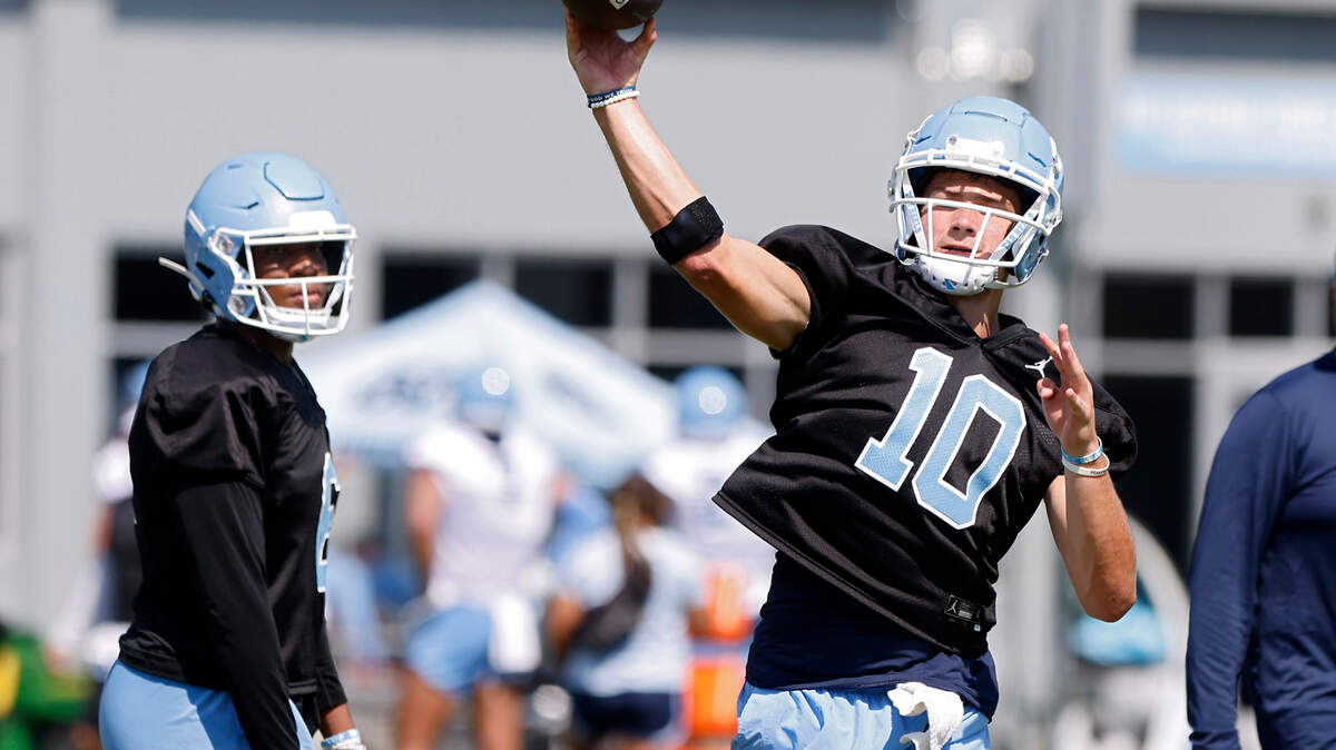 North Carolina quarterback Drake Maye (10) throws a pass during UNC’s first football practice of the season on Friday, July 29, 2022, in Chapel Hill, N.C.