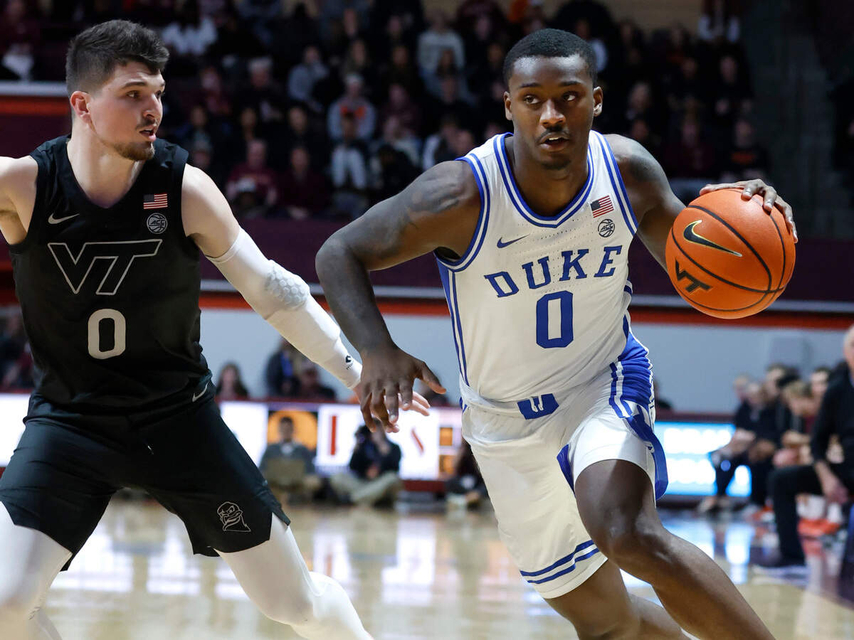 Duke’s Dariq Whitehead (0) drives around Virginia Tech’s Hunter Cattoor (0) during the second half of Virginia Tech’s 78-75 victory over Duke at Cassell Coliseum in Blacksburg, VA., Monday, Jan. 23, 2023.