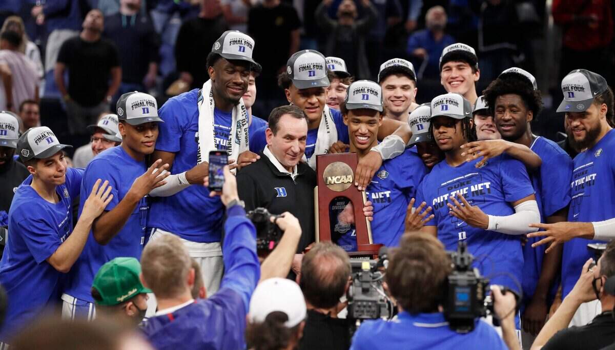 The Duke Blue Devils celebrate with the West Regional Trophy after Dukes 78-69 victory over Arkansas in the NCAA Tournament West Regional finals at the Chase Center in San Francisco, Calif., Saturday, March 26, 2022.