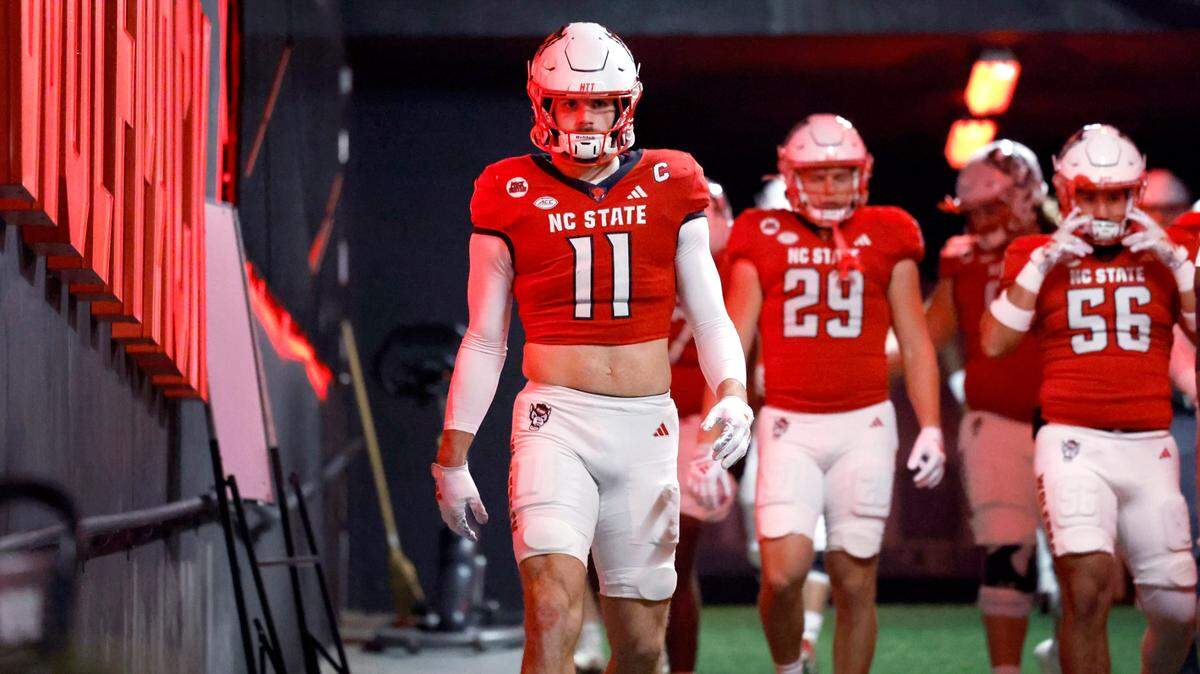 N.C. State linebacker Payton Wilson (11) heads down the tunnel to warm up before N.C. State’s game against UNC at Carter-Finley Stadium in Raleigh, N.C., Saturday, Nov. 25, 2023.