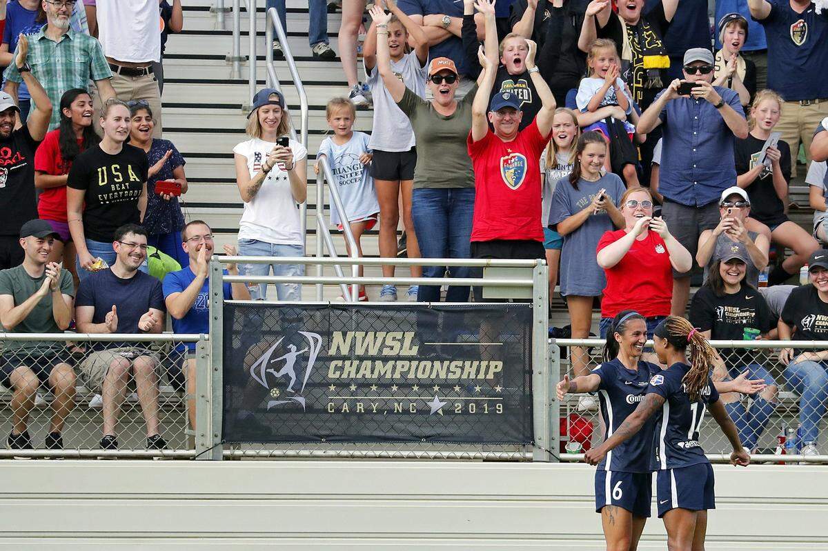 North Carolina Courage’s Jessica McDonald (14) celebrates her goal with Abby Erceg (6) during the first half of an NWSL championship soccer game against the Chicago Red Stars in Cary, N.C., in October 2019. McDonald is one of just a handful of mothers who play professional soccer in the NWSL.