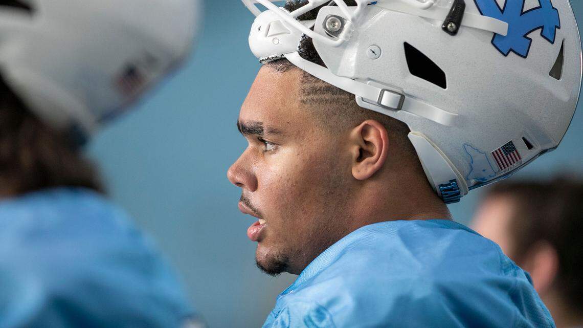 North Carolina offensive lineman Zach Rice (55) takes a break during the opening day of the Tar Heels’ spring football practice on Tuesday, March 1, 2022 in Chapel Hill, N.C.