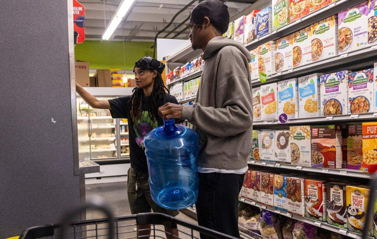 Jada Jinwright, left, Jamari Williams of Pittsboro fill water bottles at Chatham Marketplace in Pittsboro on Tuesday, May 7, 2024.
