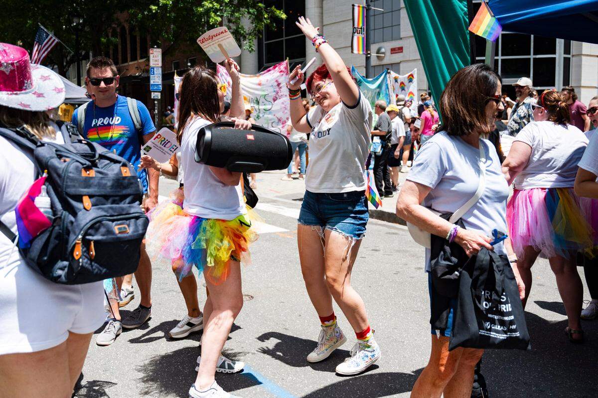 People at pride dance to “HOT TO GO” by Chappell Roan on Fayetteville St. at Raleigh Pride on Saturday, June 22, 2024.