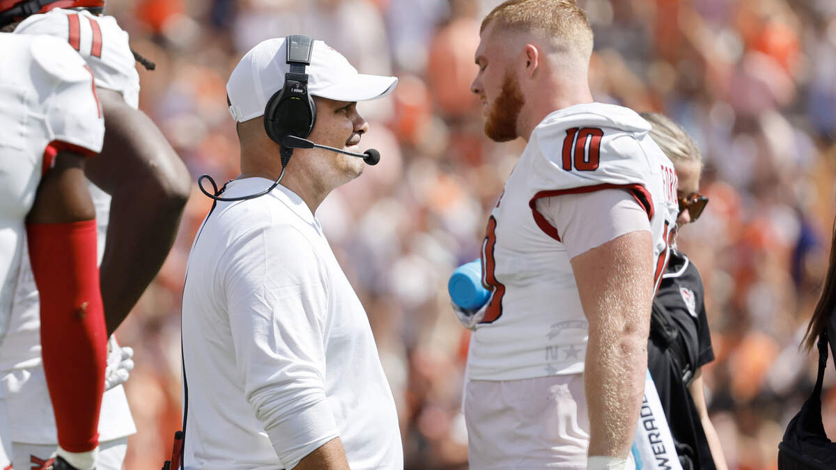 N.C. State defensive coordinator Tony Gibson talks with linebacker Caden Fordham (10) during the first half of N.C. State’s game against Clemson at Memorial Stadium in Clemson, S.C., Saturday, Sept. 21, 2024.