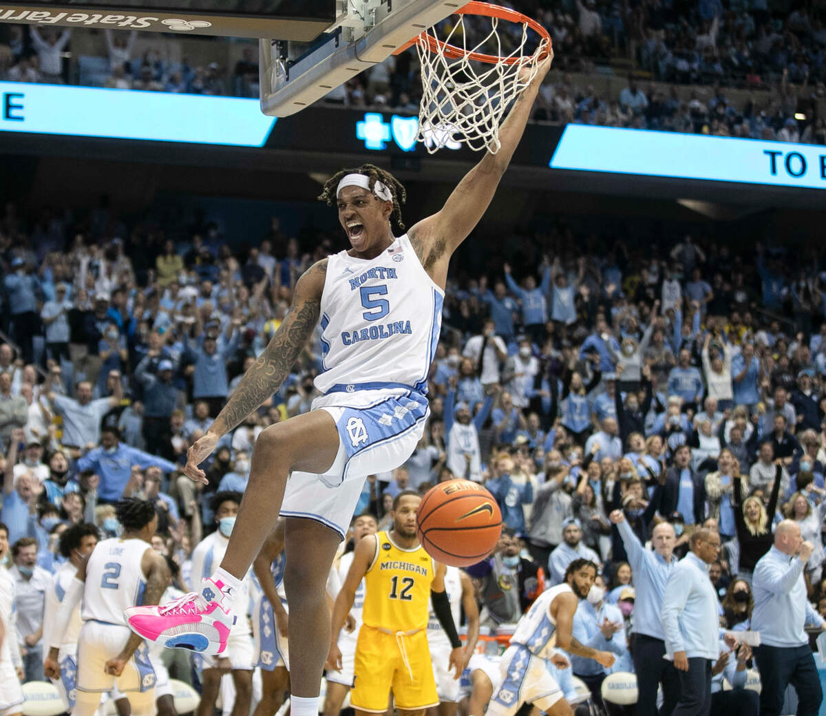 North Carolina’s Armando Bacot (5) reacts after a dunk during the second half against Michigan on Wednesday, December 1, 2021 at the Smith Center in Chapel Hill, N.C. Bacot scored 11 points in the Tar Heels’ 72-51 victory.