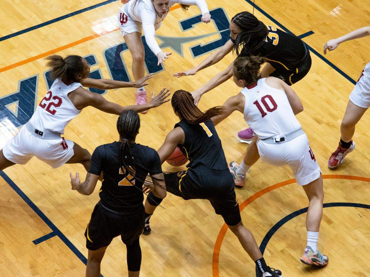 VCU and Indiana players reach for a loose ball during the second quarter of a college basketball game in the first round of the women’s NCAA tournament at the University of Texas at San Antonio Convocation Center in San Antonio, Texas, Monday, March 22, 2021. 