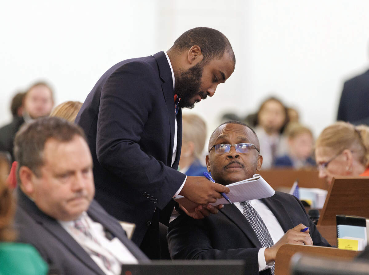 Rep. Terry Brown speaks with N.C. House Democratic Leader Robert Reives during the House session on Wednesday, July 1, 2026, at the Legislative Building in Raleigh, N.C.