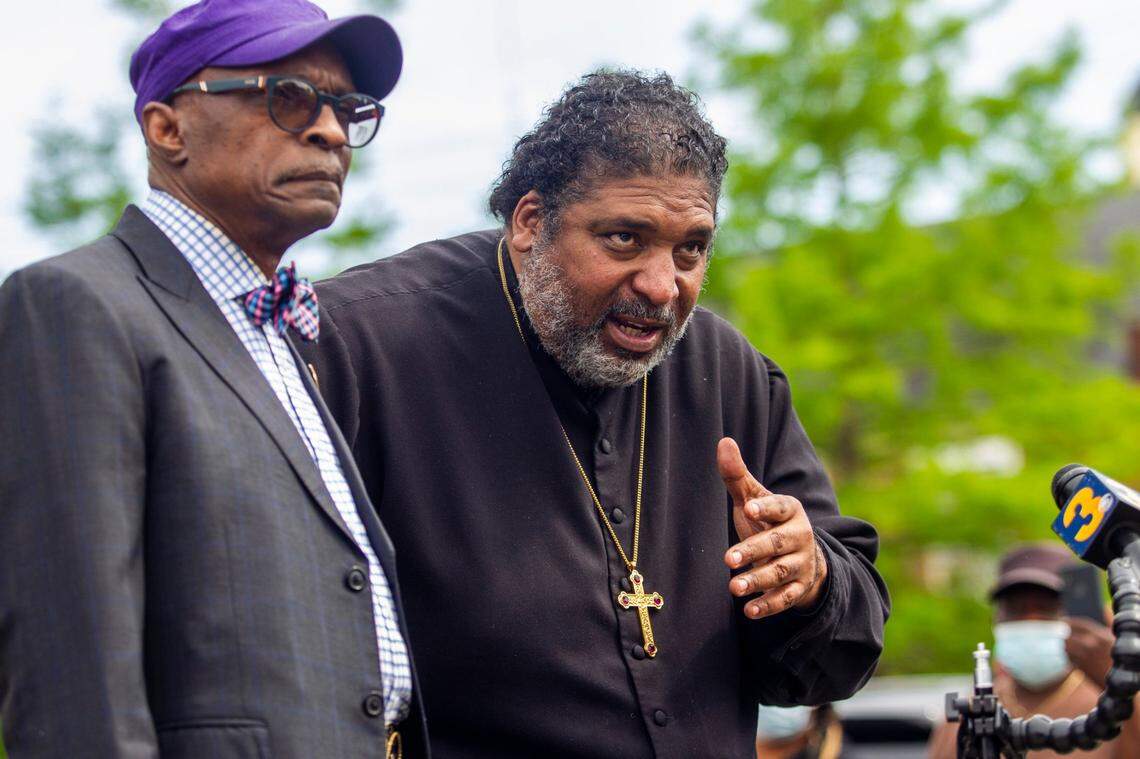 Rev. William Barber II, right, and former North Carolina NAACP President Rev. T. Anthony Spearman speak during a press conference outside the Pasqoutank County Public Safety building in Elizabeth City Tuesday, May 11, 2021 as family of Andrew Brown Jr. viewed 16 minutes of video from the police shooting death of Brown in April.