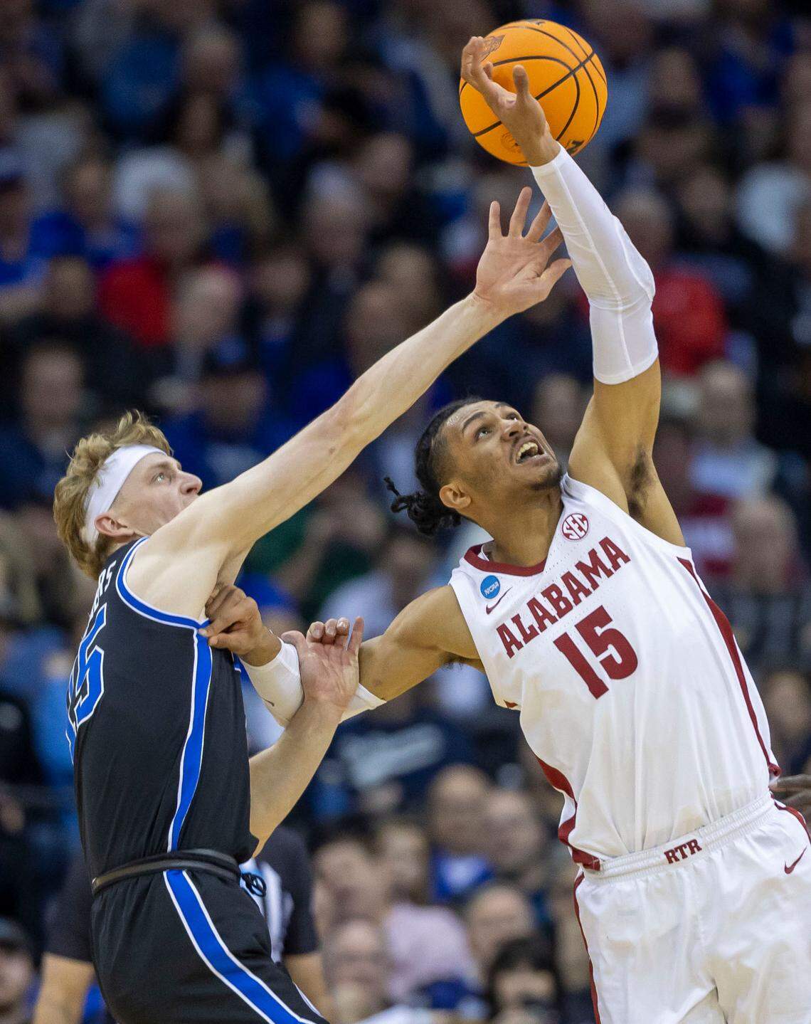 Alabama forward Jarin Stevenson (15) goes after a defensive rebound against BYU’s Richie Saunders (15) in the second half of their Sweet 16 game on Thursday, March 27, 2025 at Prudential Center in Newark, NJ.