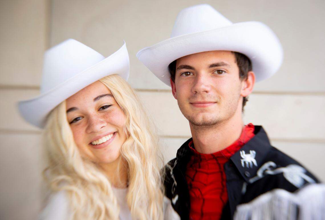 Blythe Lkayner as Spider Barbie and Brian Bordeaux as Spider Ken pose outside of GalaxyCon in downtown Raleigh, Friday, July 28, 2023.
