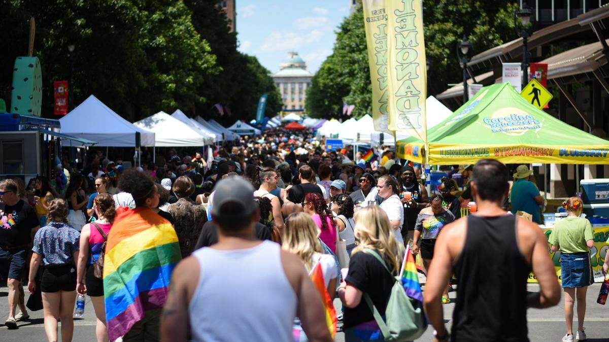 Out! Raleigh Pride festival attendees and vendors fill Fayetteville Street in downtown Raleigh on Saturday, June 25, 2022.