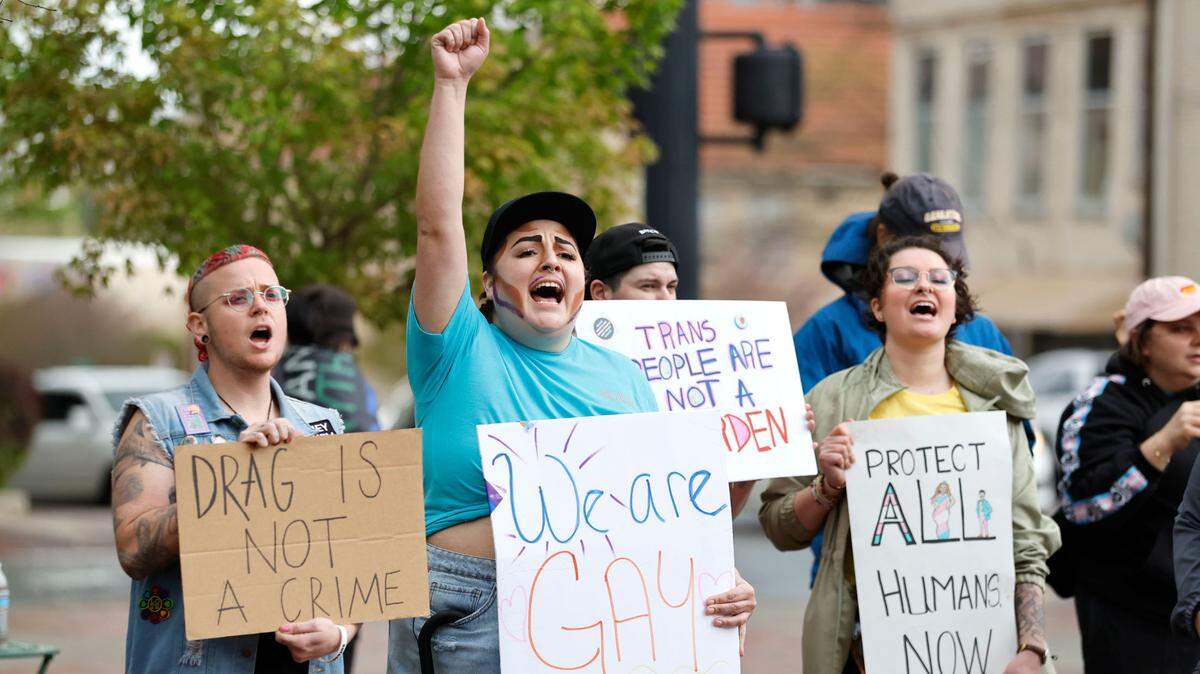 Landon Byrd, left, whose stage name is S.S. Byrdie, left, and Brookelyn Paden-Dean, whose stage name is Sol Luna, cheer on a speaker during the Drag the Fascists rally at CCB Plaza in Durham, N.C., Saturday, April 1, 2023. The rally was to protest the anti-drag show bills being introduced in states across the country and celebrate Gay, Lesbian, Bisexual, Transgender, Queer, Intersex, and Asexual people.
