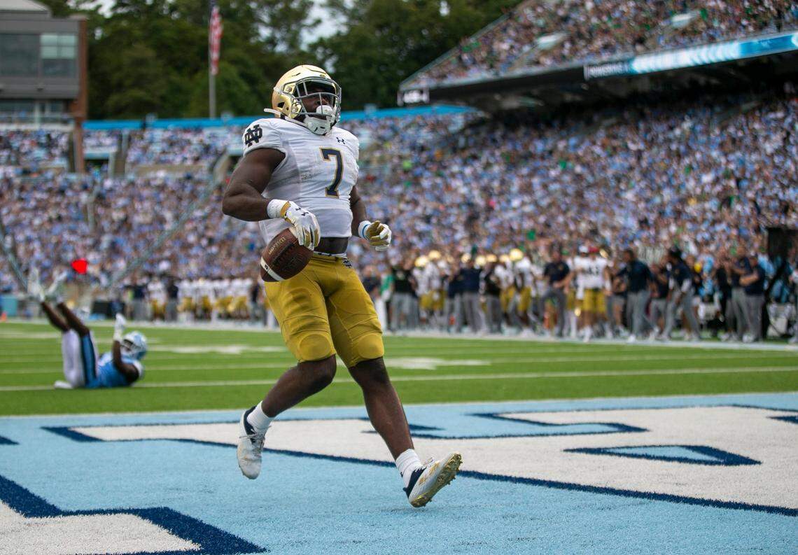 Notre Dame’s Audric Estime (7) scores on a one-yard run to give the Irish a 21-14 lead over North Carolina in the second quarter on Saturday, September 24, 2022 at Kenan Stadium in Chapel Hill, N.C.