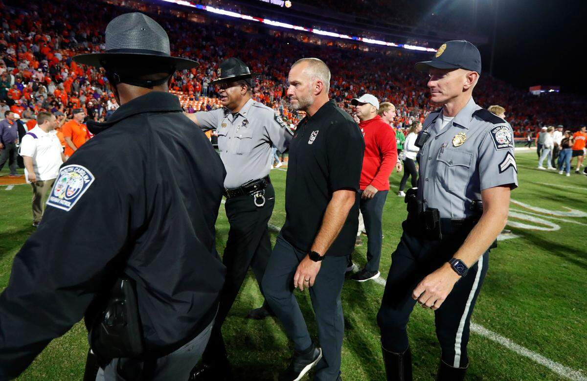 N.C. State head coach Dave Doeren walks off the field after Clemson’s 30-20 victory over N.C. State at Memorial Stadium in Clemson, S.C., Saturday, Oct. 1, 2022.