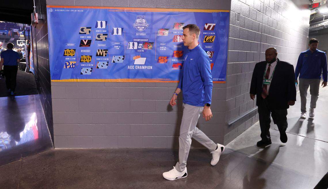 Duke head coach Jon Scheyer heads out to the court during warmups before Duke’s game against Louisville in the finals of the 2025 ACC Men’s Basketball Tournament at the Spectrum Center in Charlotte, N.C., Saturday, March 15, 2025.