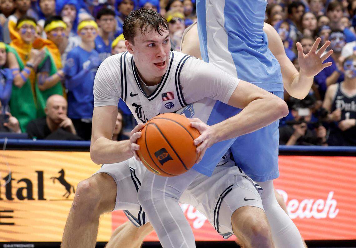 Duke’s Cooper Flagg (2) passes out of the pressure by North Carolina’s Jalen Washington (13) during the second half of Duke’s 87-70 victory over UNC at Cameron Indoor Stadium in Durham, N.C., Saturday, Feb. 1, 2025.