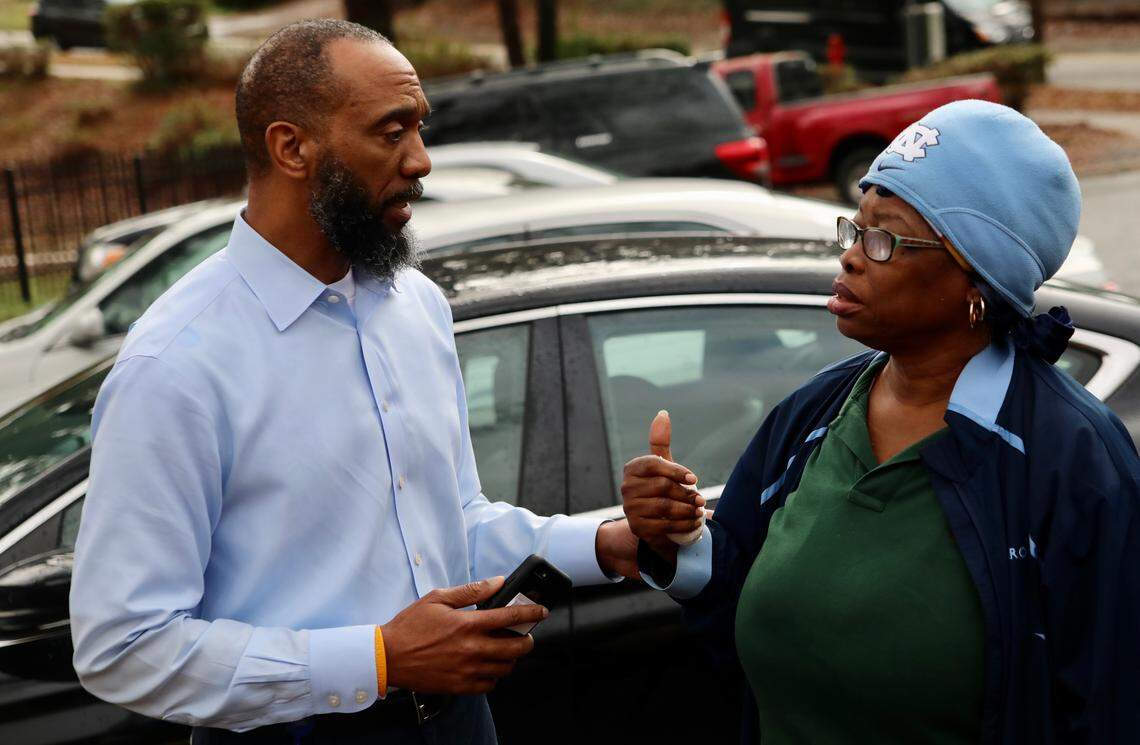 Anthony Scott, CEO of Durham Housing Authority, talks to Gloria Fortune about her brother Brian’s apartment at McDougald Terrace in Durham. Emergency evacuations began at the public housing complex on Friday night, Jan. 3, amid carbon monoxide poisoning concerns.