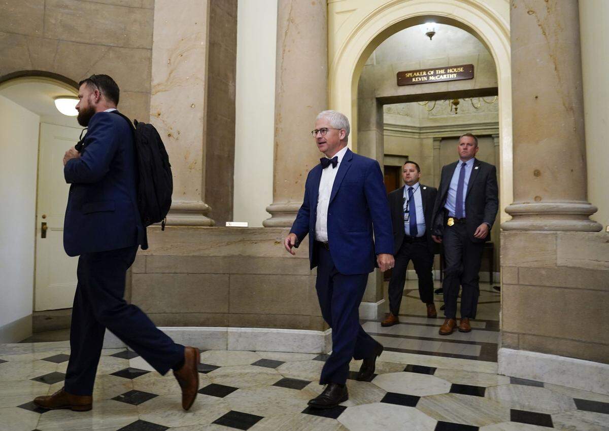 Oct 4, 2023; Washington, D.C., USA:  Speaker Pro-Tempore Patrick McHenry (R-N.C.), center, leaves the Speaker of the House office in the United States Capitol to gavel in the House Chambers on Wednesday, Oct. 4, 2023. McHenry was appointed temporary Speaker Pro Tempore after Kevin McCarthy became the first Speaker of the House to be stripped of his role during a legislative term in U.S. history. Mandatory Credit: Jack Gruber-USA TODAY