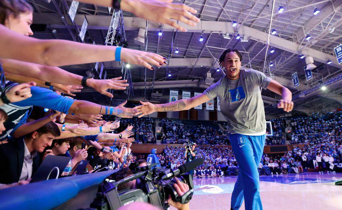 Duke’s Dereck Lively II greets the Cameron Crazies after being introduced during Duke’s Countdown to Craziness at Cameron Indoor Stadium in Durham, N.C., Friday, Oct. 21, 2022.