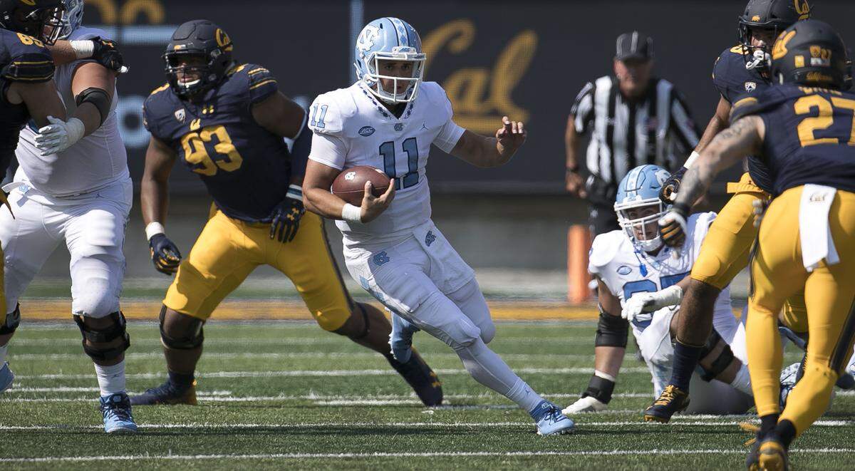 North Carolina quarterback Nathan Elliott (11) picks up ten yards and a first down in the third quarter against California. Elliott used for 58 yards in the Tar Heels’ 24-17 loss on Saturday, September 1, 2018, at Memorial Stadium in Berkeley, Calif.