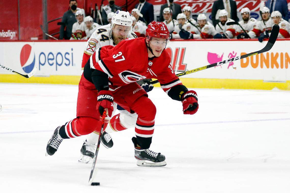 Carolina Hurricanes’ Andrei Svechnikov (37) brings the puck up the ice after taking it away from Florida Panthers’ Kevin Connauton (44) during the second period of an NHL hockey game in Raleigh, N.C., Sunday, March 7, 2021. (AP Photo/Karl B DeBlaker)