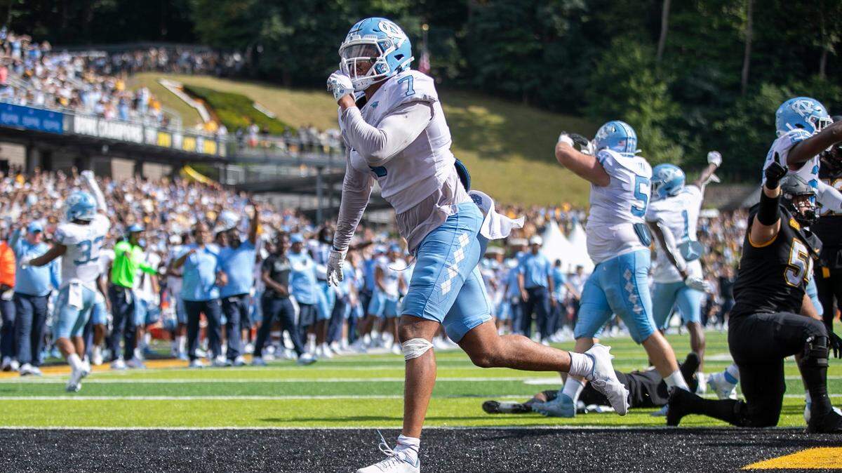 North Carolinas Noah Taylor (7) reacts after stopping Appalachian State quarterback Chase Brice at the goal line, preventing a two-point conversion and securing North Carolinas 63-61 victory on Saturday, September 3, 2022 at Kidd Brewer Stadium in Boone, N.C.