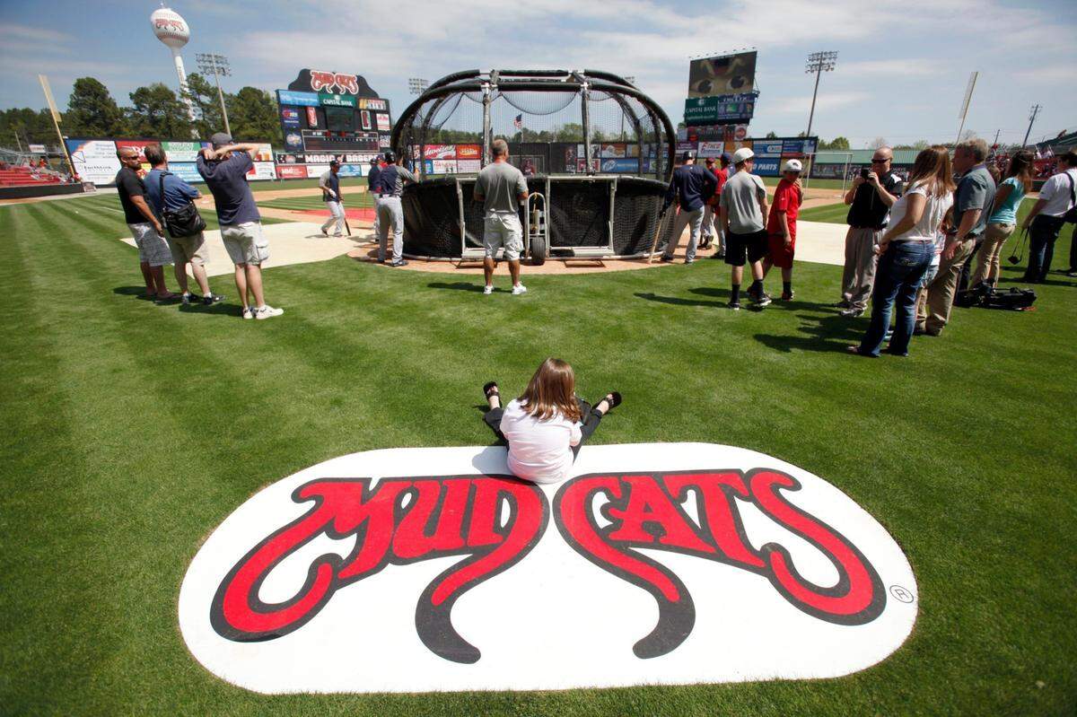 Six-year-old Emma Strickland enjoys front row seating to pre-game warmups during an exhibition game between the Carolina Mudcats and the Cleveland Indians last April. The Mudcats recently announced their schedule for 2013.