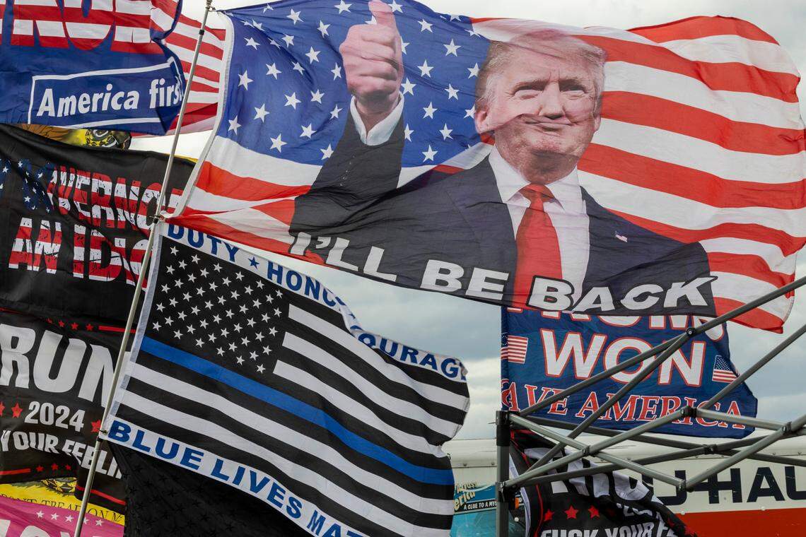 Flags fly outside a rally featuring former President Donald Trump in Selma, NC on Saturday, April 9, 2022.