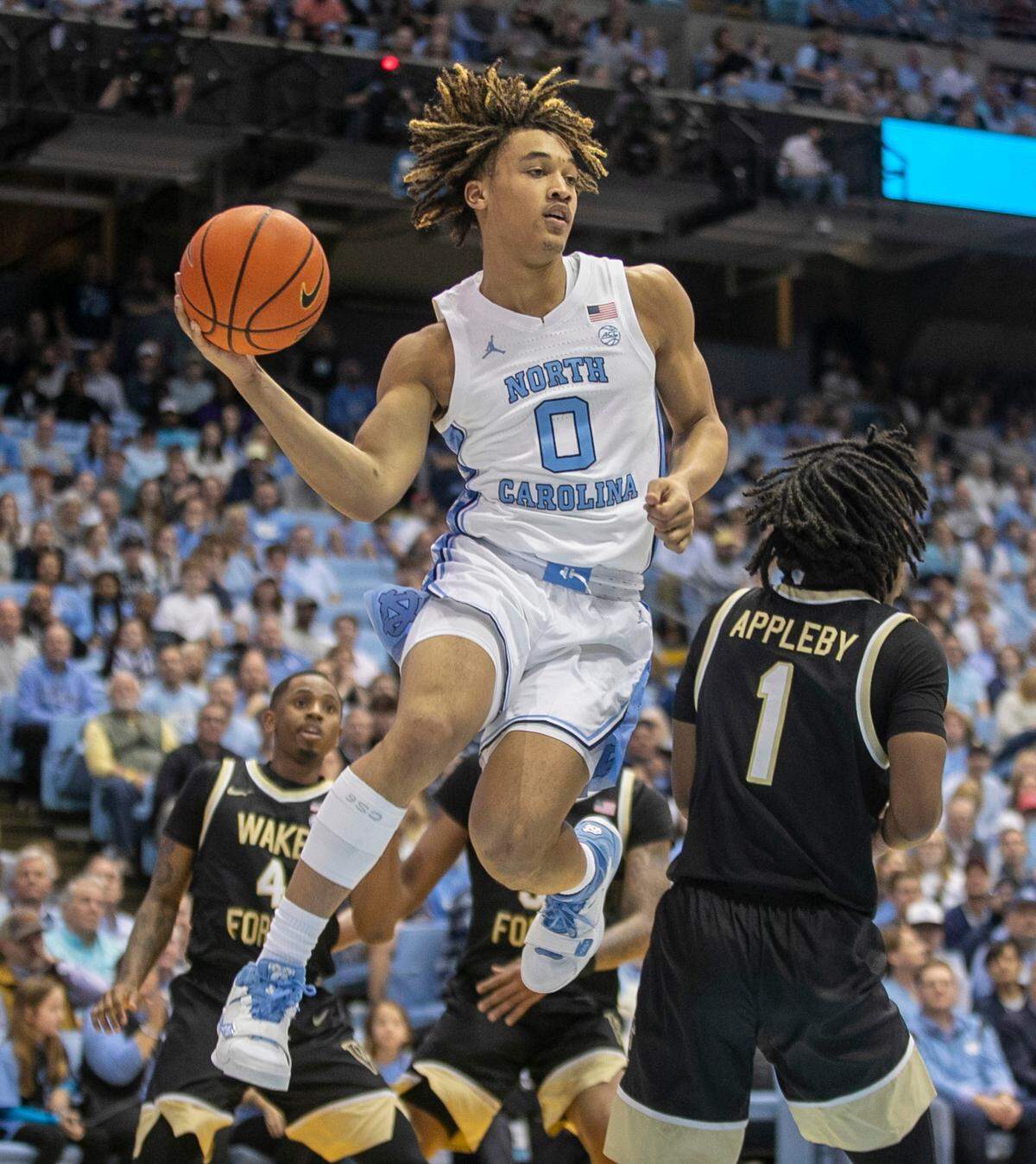 North Carolina’s Seth Trimble (0) drives against Wake Forest’s Tyree Appleby (1) during the first half on Wednesday, January 4, 2023 at the Smith Center in Chapel Hill, N.C.