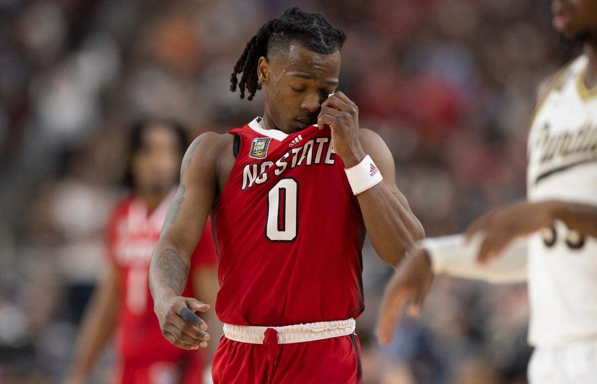 Down by 12 points, N.C. State’s D.J. Horne (0) reacts after missing a three-point attempt with 5:03 to play against Purdue in the NCAA Final Four National Semifinal on Saturday, April 6, 2024 at State Farm Stadium in Glendale, AZ. Purdue defeated N.C. State 63-53.